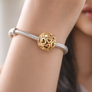 Openwork Heart Charm — worn on wrist