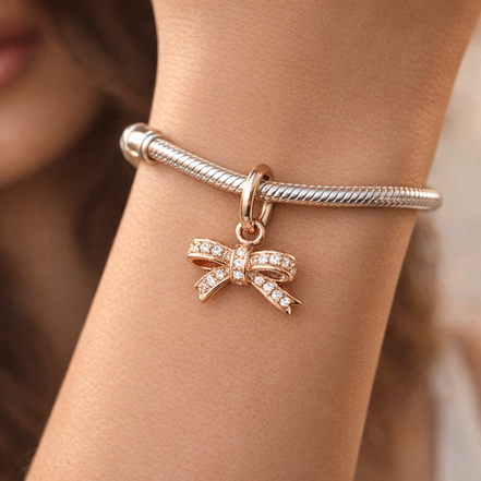 Rose Pav? Bow Dangle Charm - Rose Pav? Bow Dangle Charm — worn on wrist