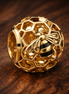 Gold Plated Honeycomb Heart Charm - Gold Plated Honeycomb Heart Charm — display on walnut