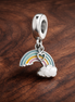 Rainbow Cloud Dangle Charm - Rainbow Cloud Dangle Charm — display on walnut