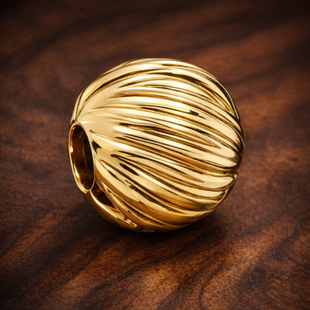 Gold Plated Ribbed Shell Charm - Gold Plated Ribbed Shell Charm — display on walnut