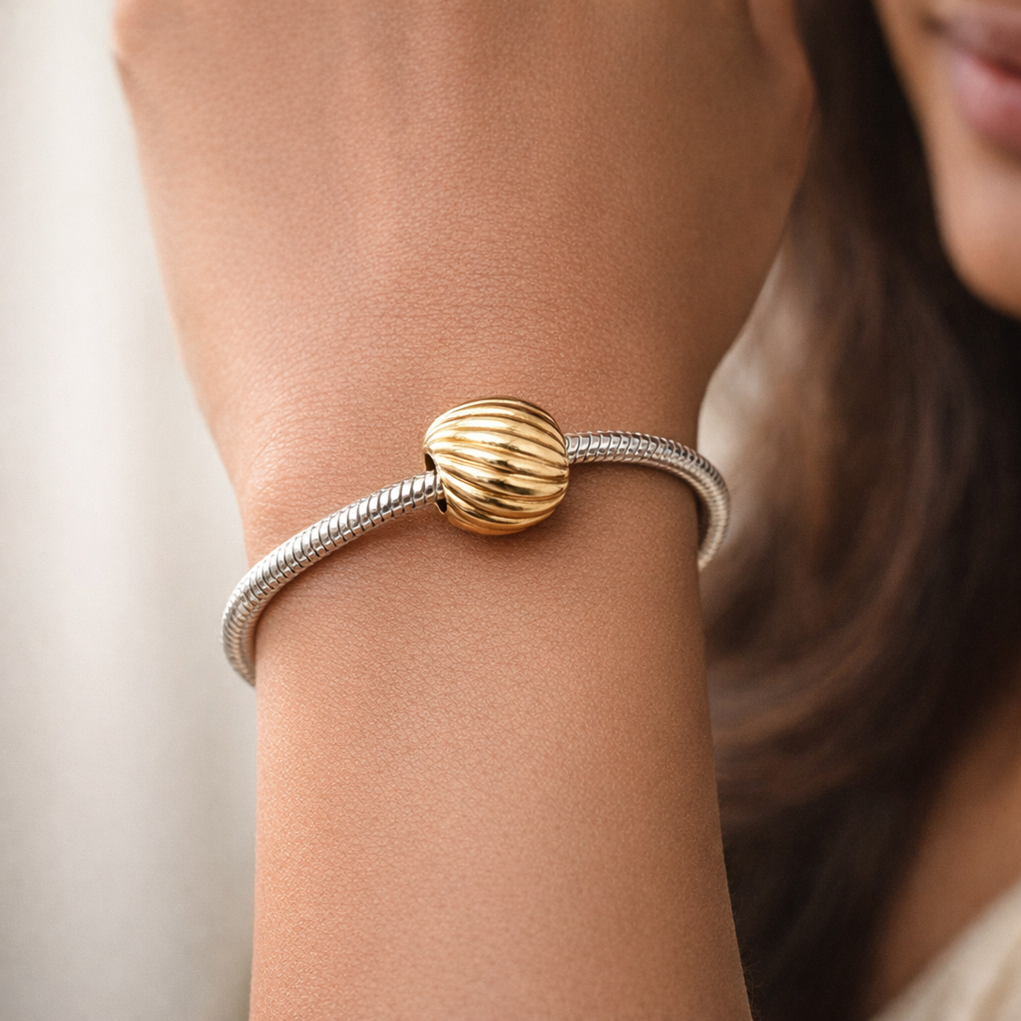 Gold Plated Ribbed Shell Charm - Gold Plated Ribbed Shell Charm — worn on wrist