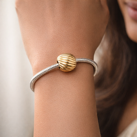 Gold Plated Ribbed Shell Charm - Gold Plated Ribbed Shell Charm — worn on wrist