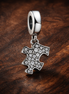 Silver Puzzle Piece Dangle Charm - Silver Puzzle Piece Dangle Charm — display on walnut