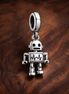 Silver Robot Charm - Silver Robot Charm — display on walnut
