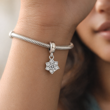 Floral Snowflake Stones - Sterling Silver Floral Snowflake Dangle Charm With Stones — worn on wrist
