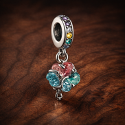 Rainbow Clover Dangle Charm - Rainbow Clover Dangle Charm — display on walnut