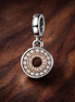 Rose Compass Halo Dangle - Rose Compass Halo Dangle Charm — display on walnut