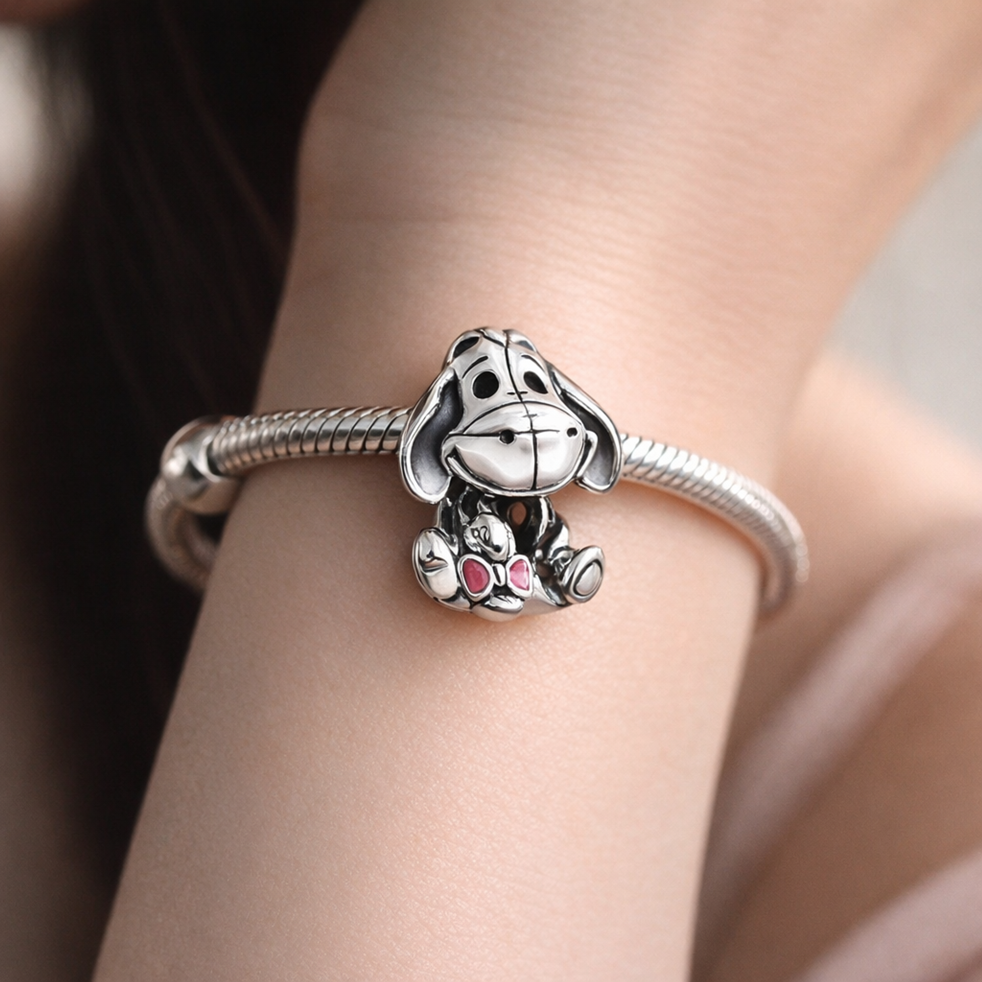 Disney Winnie the Pooh Eeyore Charm — worn on wrist