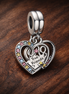 Puzzle Piece Hearts Splittable Friendship Dangle Charm — display on walnut