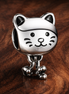 Pet Cat & Bow Charm — display on walnut