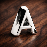 Letter A Alphabet Charm — display on walnut
