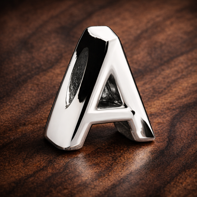 Letter A Alphabet Charm — display on walnut