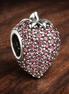 Pink Strawberry Charm - Pink Strawberry Charm — display on walnut
