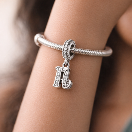 16th Celebration Charm — worn on wrist