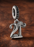 21st Celebration Dangle Charm — display on walnut