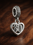 30th Celebration Dangle Charm — display on walnut