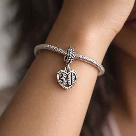 30th Celebration Dangle Charm — worn on wrist