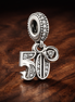 50th Celebration Dangle Charm — display on walnut