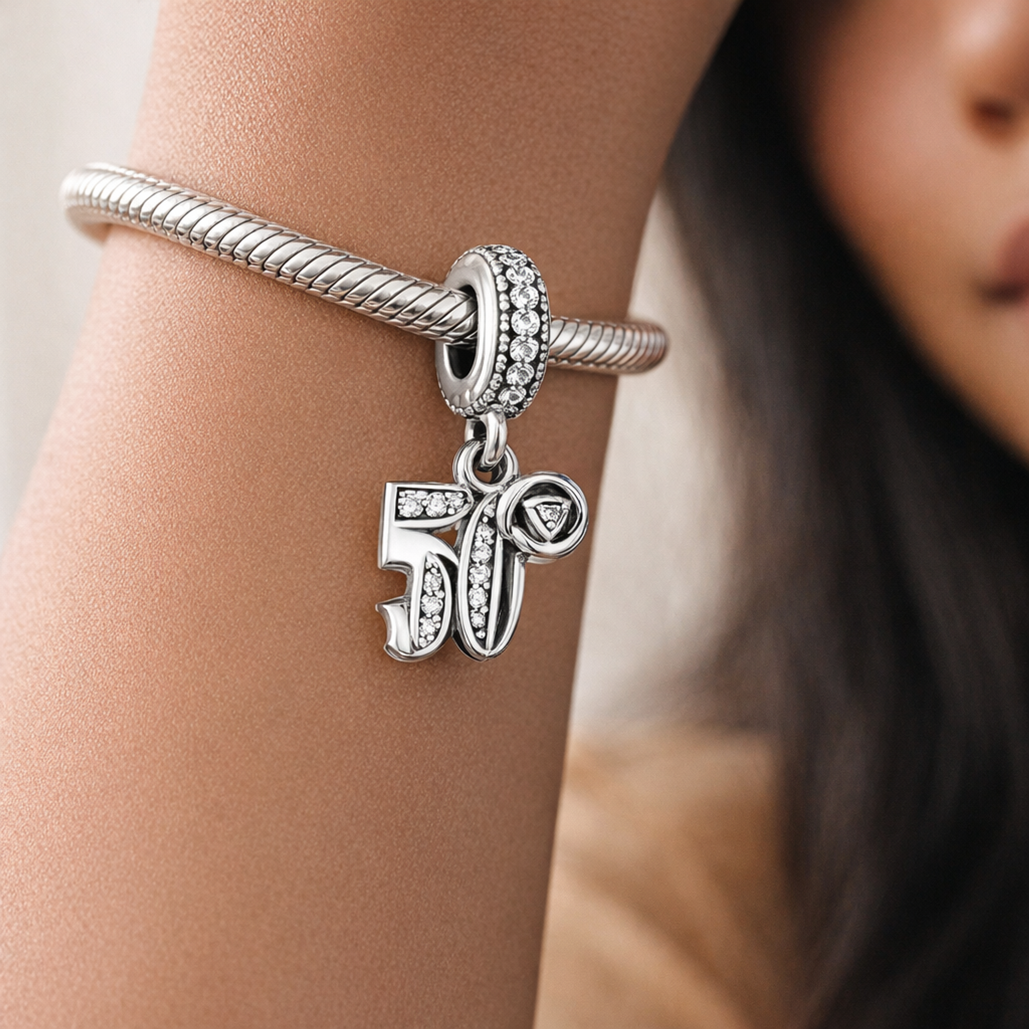 50th Celebration Dangle Charm — worn on wrist