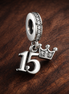 15th Birthday Dangle Charm — display on walnut