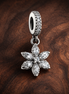 Sparkling Herbarium Cluster Dangle Charm — display on walnut