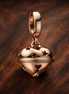 Festive Bell Dangle Charm — display on walnut