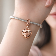 Festive Bell Dangle Charm — worn on wrist