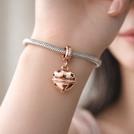 Festive Bell Dangle Charm — worn on wrist