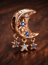 Star & Crescent Moon Charm — display on walnut
