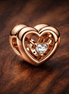 Radiant Heart & Floating Stone Charm — display on walnut
