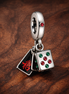 Mahjong Triple Dangle Charm — display on walnut