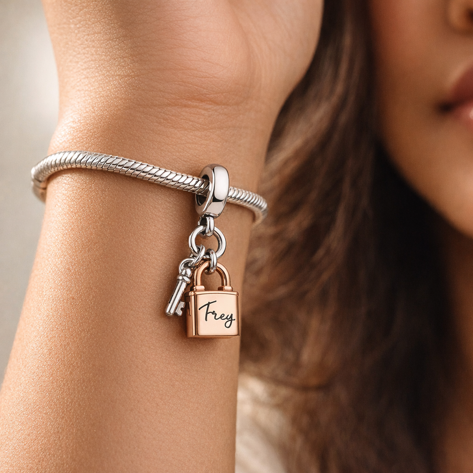 Two-tone Key, Padlock & Heart Triple Dangle Charm — worn on wrist