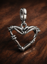 Wire Heart Medallion Charm — display on walnut