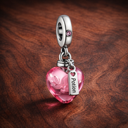 Pink Kiss Perfume Dangle - Pink Kiss Perfume Dangle Charm — display on walnut