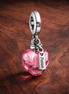 Pink Kiss Perfume Dangle - Pink Kiss Perfume Dangle Charm — display on walnut